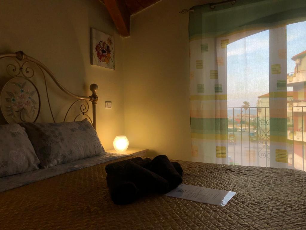 Postel nebo postele na pokoji v ubytování B&B Borgo la Marina
