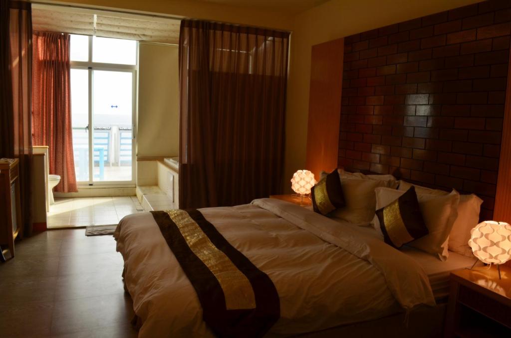 Postel nebo postele na pokoji v ubytování Yake Homestay