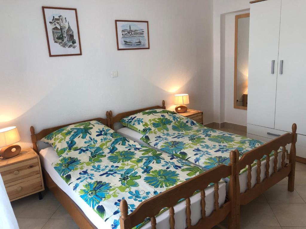 Postel nebo postele na pokoji v ubytování Dalmatia Apartments