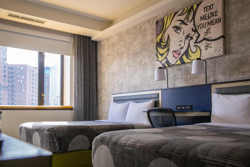 Postel nebo postele na pokoji v ubytování Leon Hotel LES