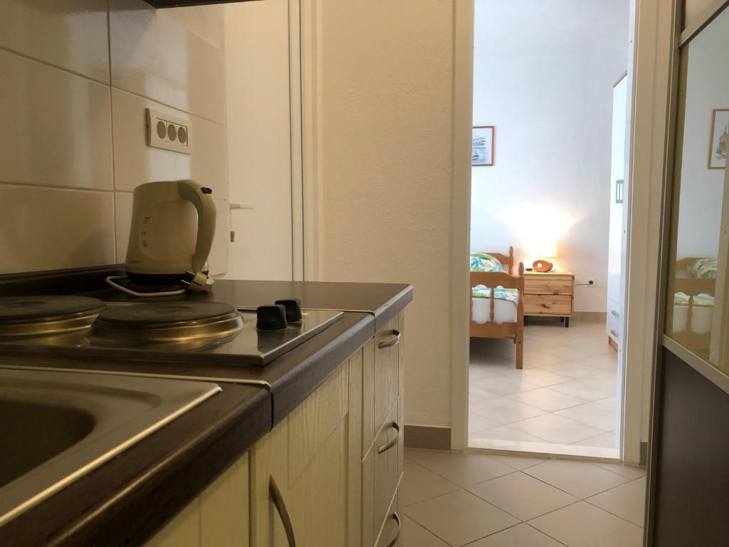 Kuchyň nebo kuchyňský kout v ubytování Dalmatia Apartments