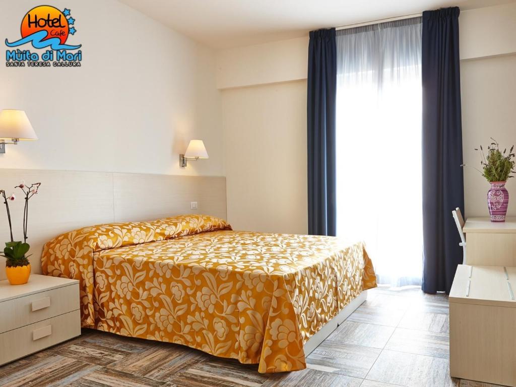 Postel nebo postele na pokoji v ubytování Hotel Muita di Mari