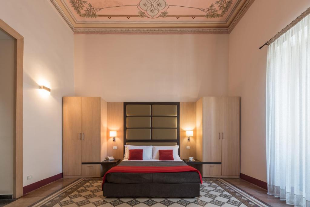 Postel nebo postele na pokoji v ubytování Hotel Vittorio Veneto