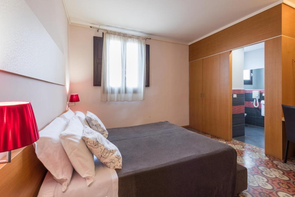 Postel nebo postele na pokoji v ubytování Hotel Vittorio Veneto