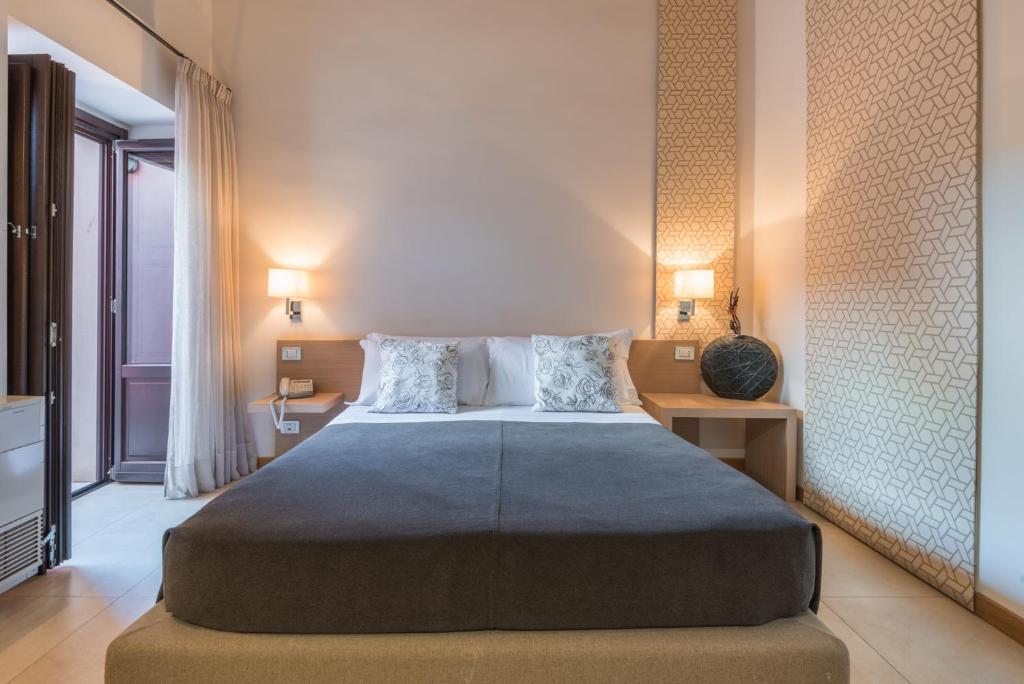 Postel nebo postele na pokoji v ubytování Hotel Vittorio Veneto