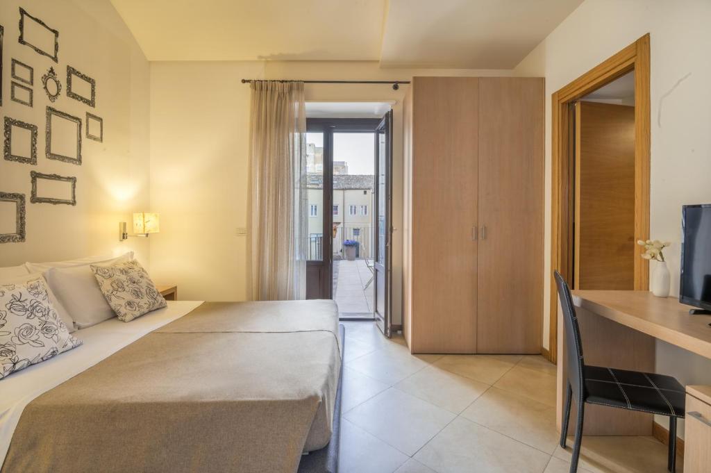Postel nebo postele na pokoji v ubytování Hotel Vittorio Veneto