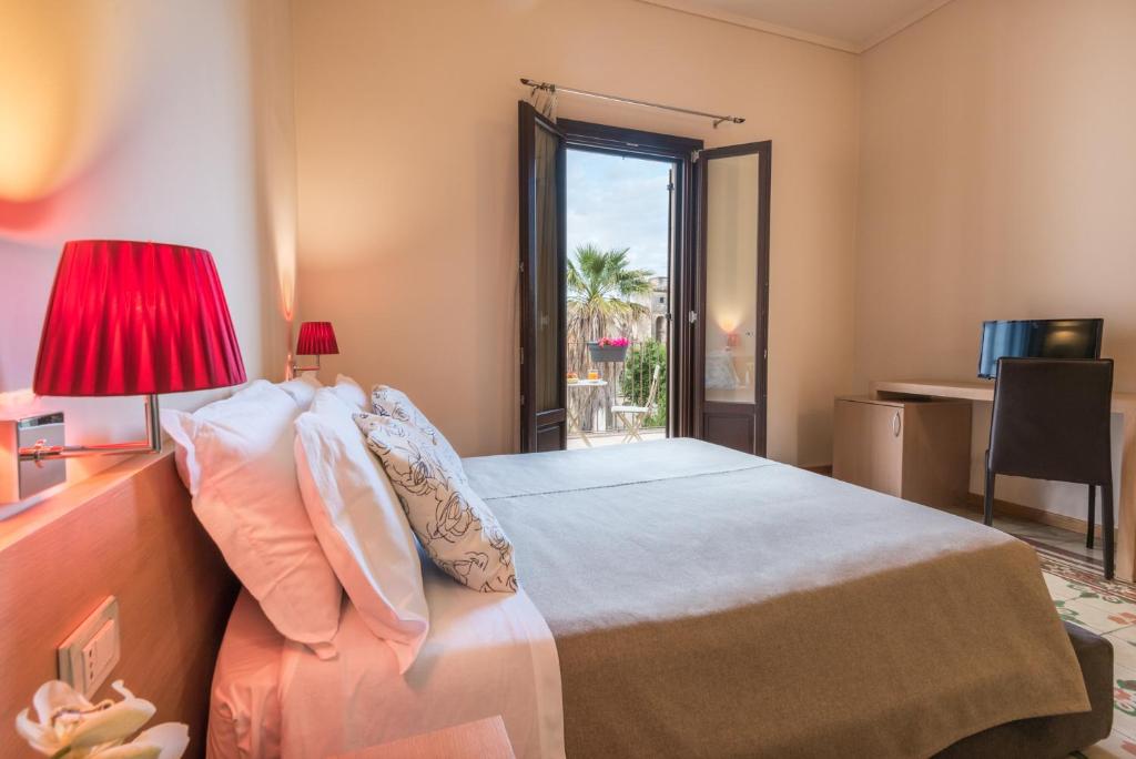 Postel nebo postele na pokoji v ubytování Hotel Vittorio Veneto
