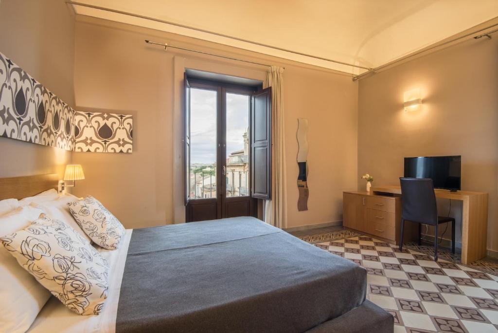 Postel nebo postele na pokoji v ubytování Hotel Vittorio Veneto