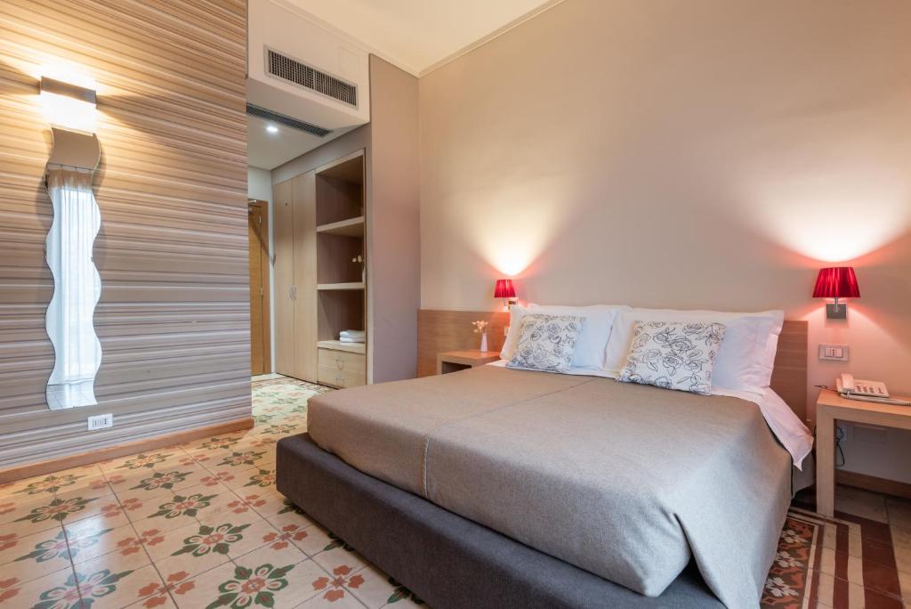 Postel nebo postele na pokoji v ubytování Hotel Vittorio Veneto