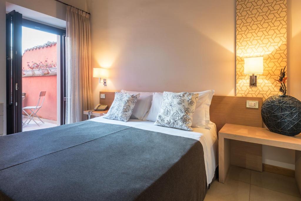 Postel nebo postele na pokoji v ubytování Hotel Vittorio Veneto