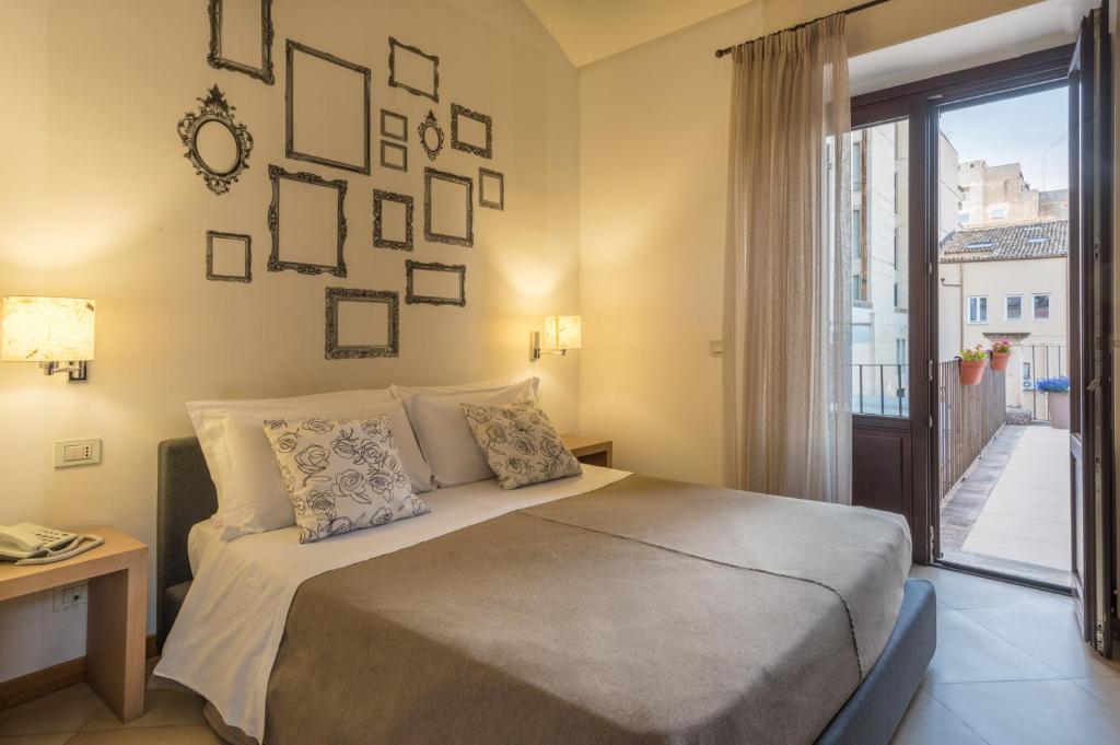 Postel nebo postele na pokoji v ubytování Hotel Vittorio Veneto