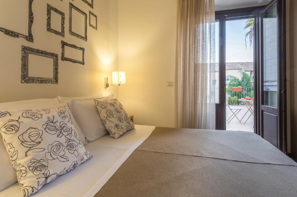 Postel nebo postele na pokoji v ubytování Hotel Vittorio Veneto