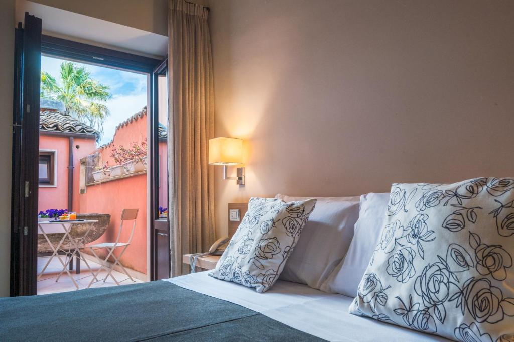 Postel nebo postele na pokoji v ubytování Hotel Vittorio Veneto