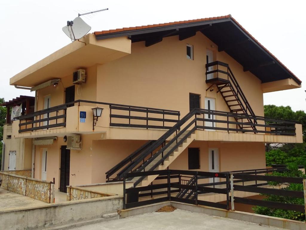a building with stairs on the side of it at Zana Apartments in Stan Trigraci