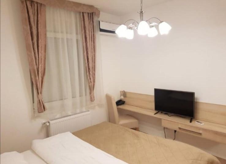 Postel nebo postele na pokoji v ubytování RoyalWings apartman Jagodina