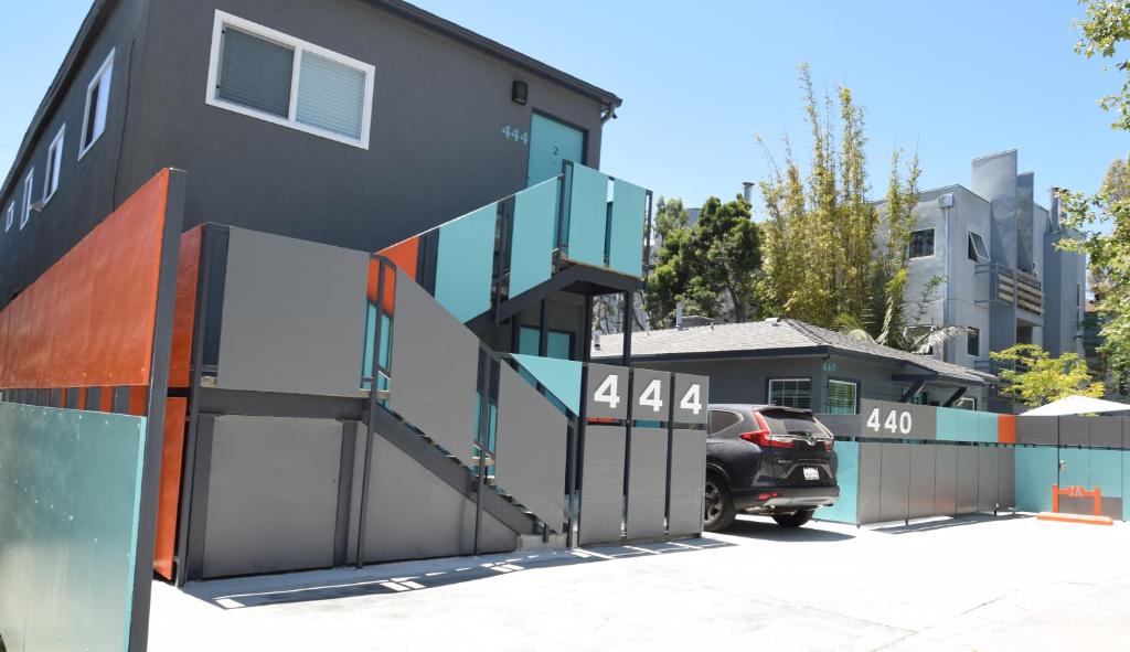 a house with a gate and a car parked outside at Venice Beach Apartments Monthly rents in Los Angeles