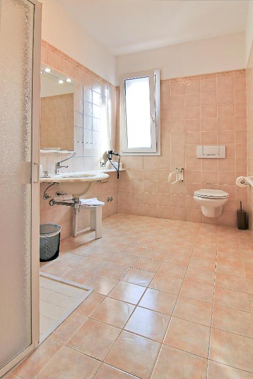 Kúpeľňa v ubytovaní Hotel La Perla