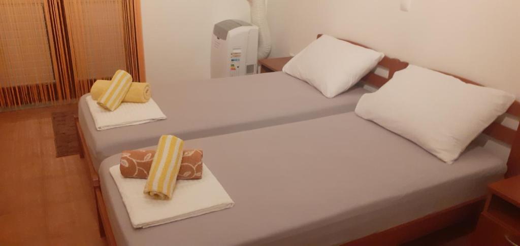 Posteľ alebo postele v izbe v ubytovaní Apartman GRL