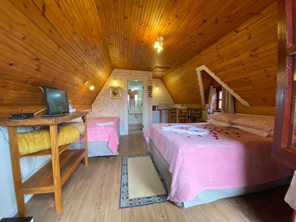Postel nebo postele na pokoji v ubytování Chalés Paraíso Monte Verde