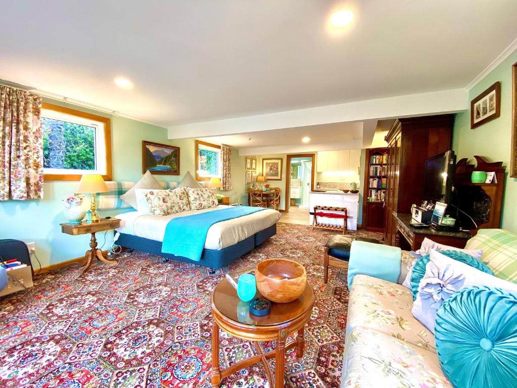 a living room with a bed and a couch at Ah House City B&B Nelson in Nelson