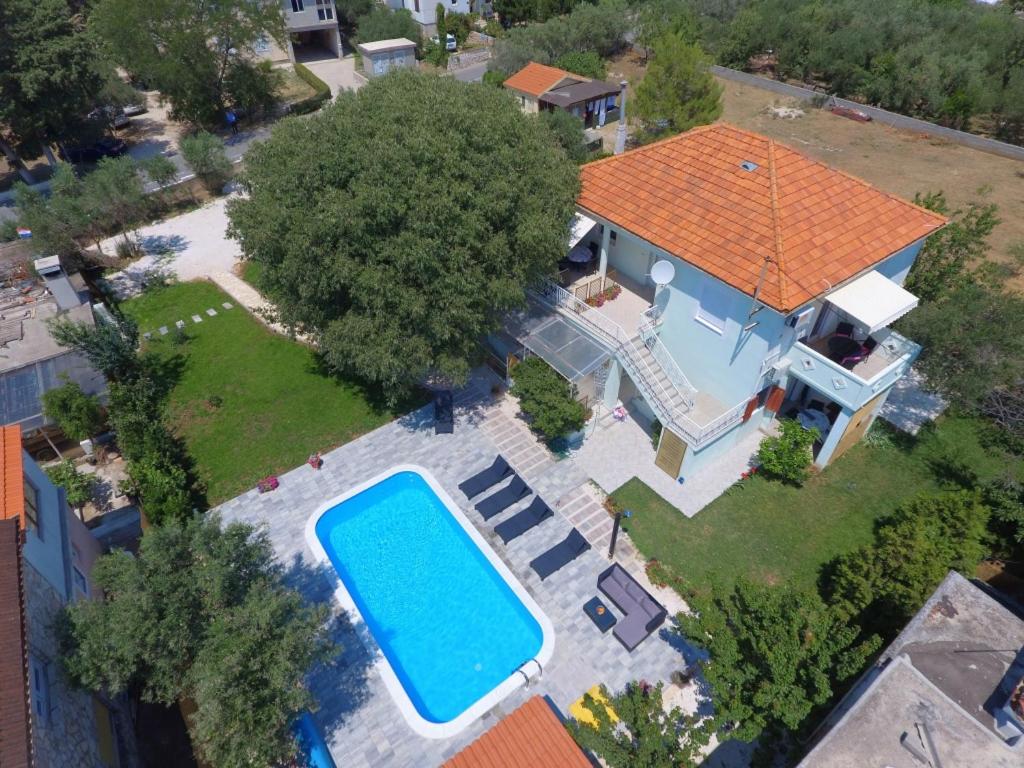 an overhead view of a house with a swimming pool at Apartment 877-1 in Bibinje