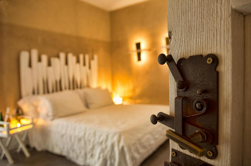 Łóżko lub łóżka w pokoju w obiekcie La Pampa Relais & Spa