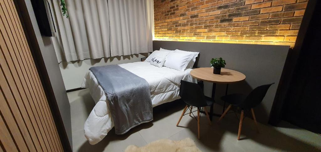 Postel nebo postele na pokoji v ubytování Malbec Casa Hotel