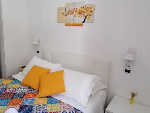 Postel nebo postele na pokoji v ubytování B&B Capo Le Vigne