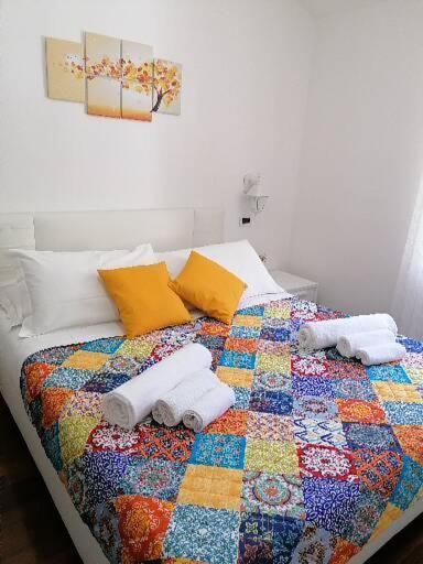 Postel nebo postele na pokoji v ubytování B&B Capo Le Vigne