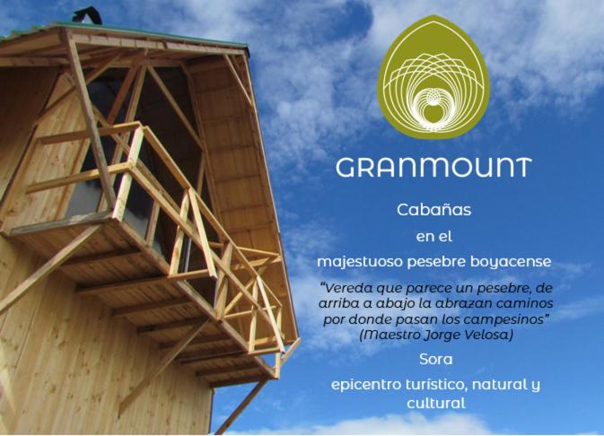 ein Flyer für ein Gebäude mit einem Turm in der Unterkunft GranMount Cabañas in Boyacá