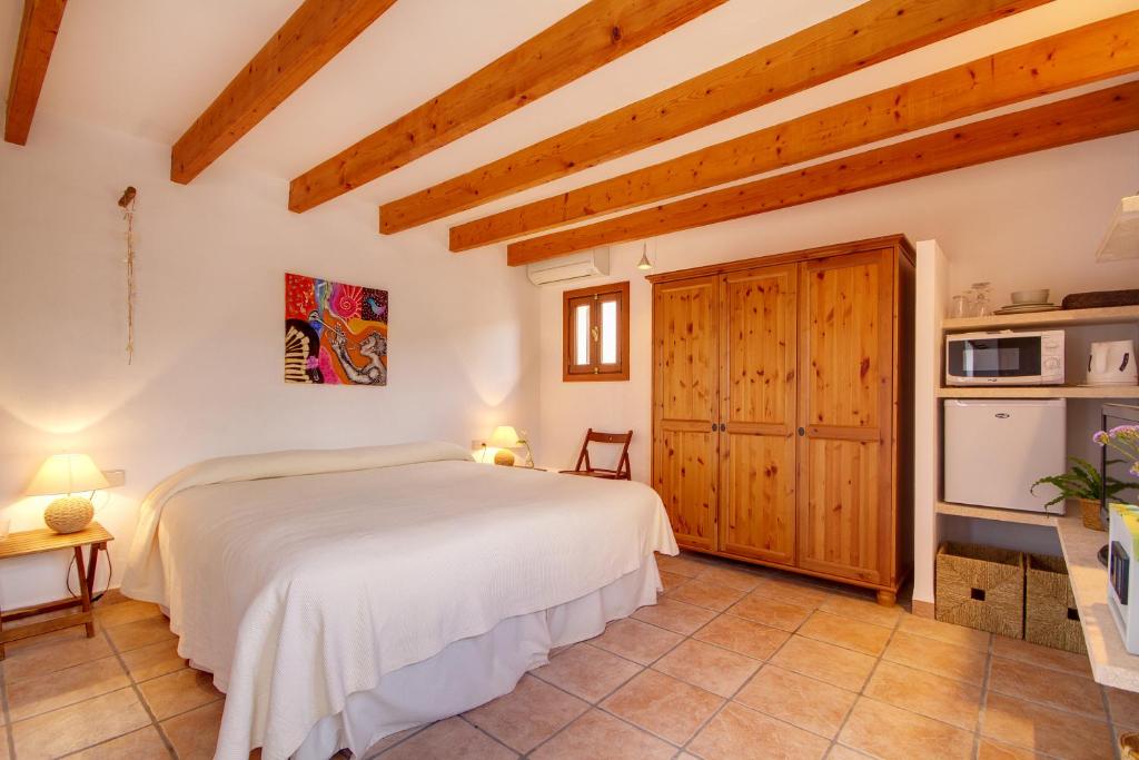 Postel nebo postele na pokoji v ubytování Finca Agroturismo Can Carro