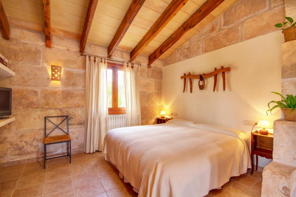 Postel nebo postele na pokoji v ubytování Finca Agroturismo Can Carro