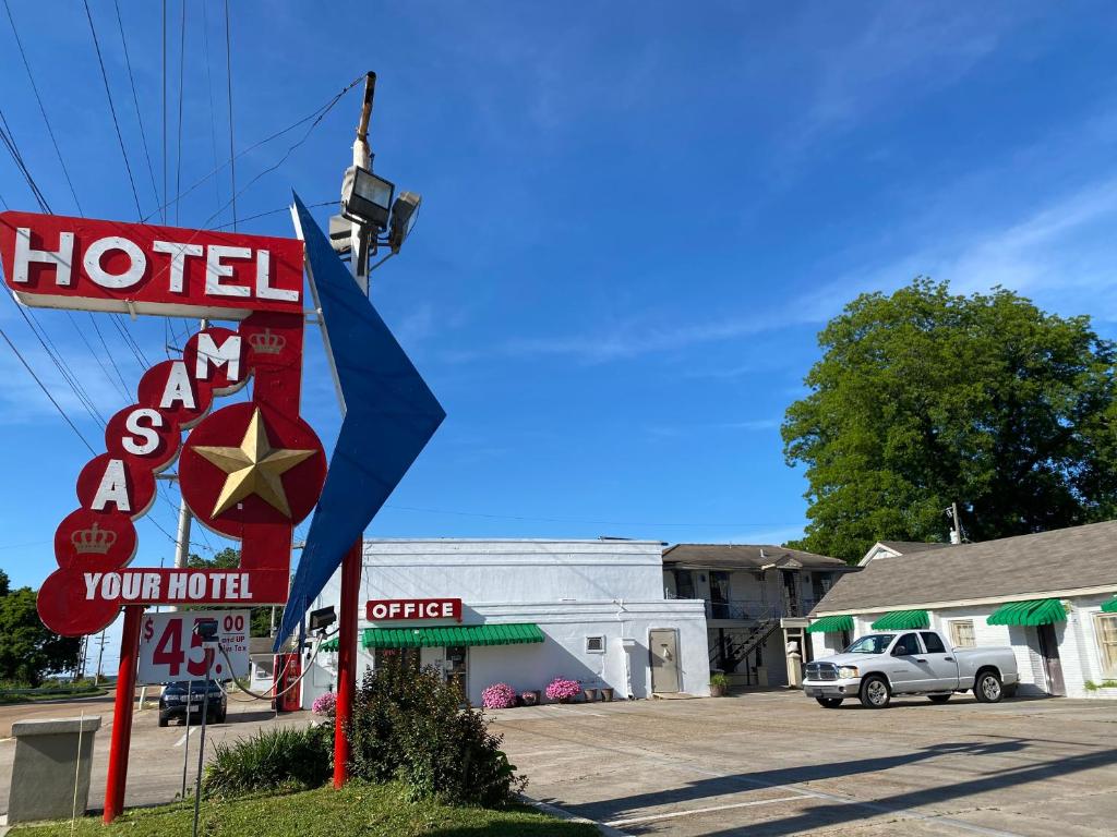 a sign for a hotel and a motel at ASAM HOTEL in Vicksburg