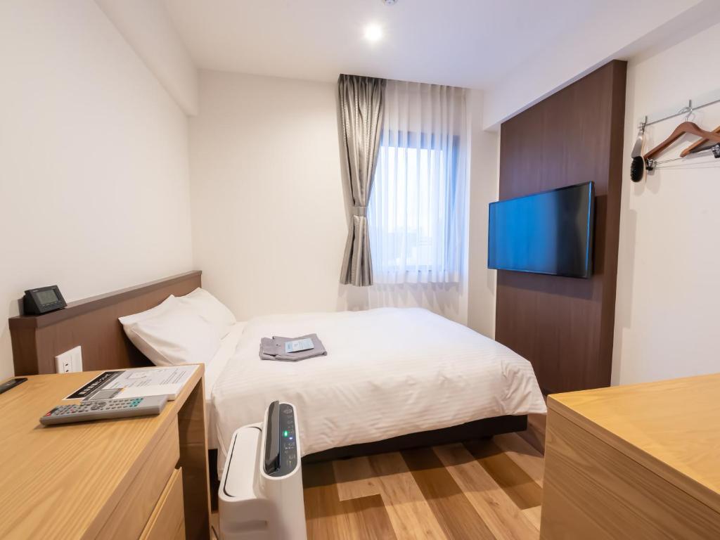 Uma televisão e/ou sistema de entretenimento em ACCESS by LOISIR HOTEL Nagoya