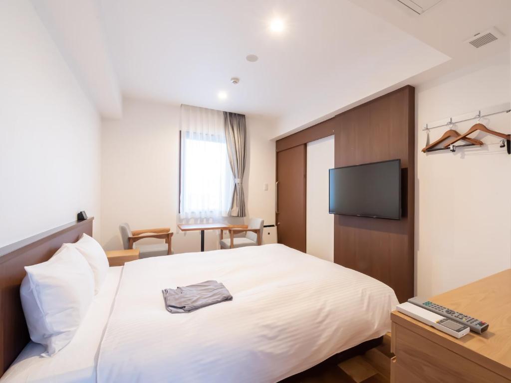 Uma cama ou camas num quarto em ACCESS by LOISIR HOTEL Nagoya