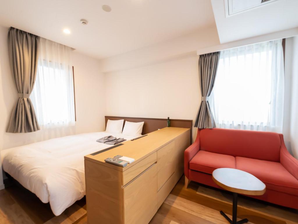 Uma cama ou camas num quarto em ACCESS by LOISIR HOTEL Nagoya