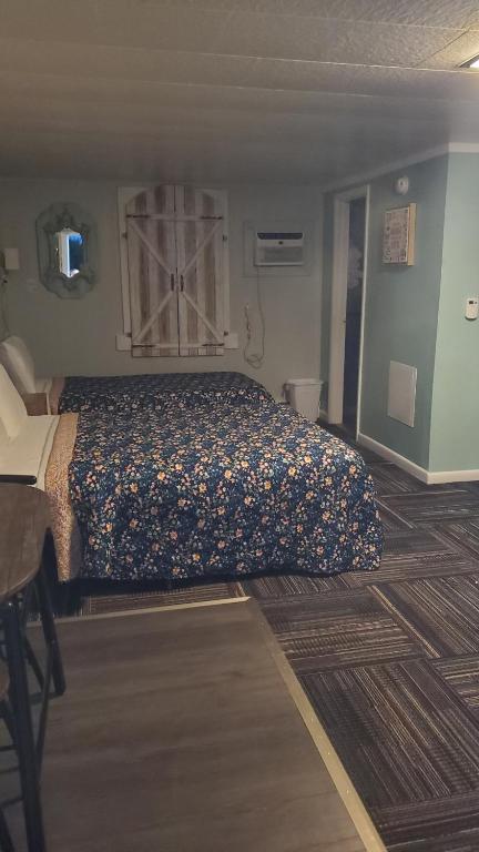Postel nebo postele na pokoji v ubytování Sage Motel
