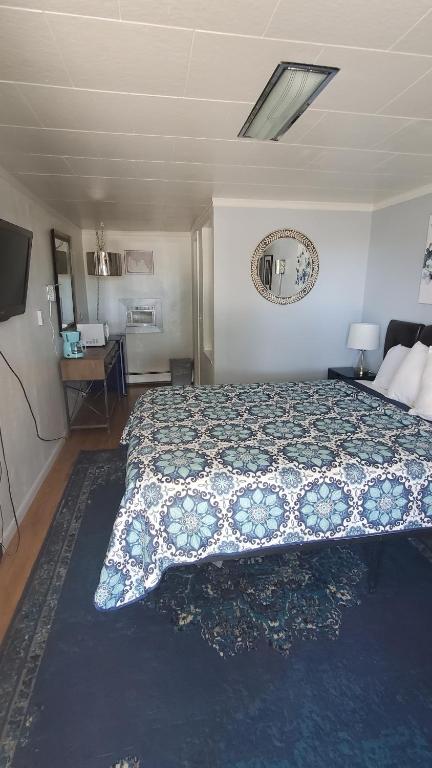 Postel nebo postele na pokoji v ubytování Sage Motel