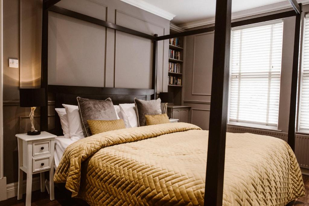 Postel nebo postele na pokoji v ubytování Kilmore Guesthouse