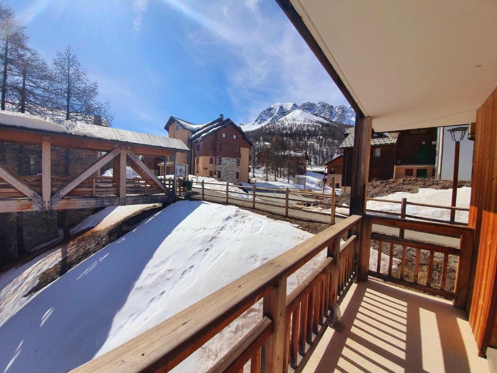 a balcony of a house with snow on the ground at Les Chalets Des Rennes - VARS - T2 4 personnes - CDRA53 in Vars