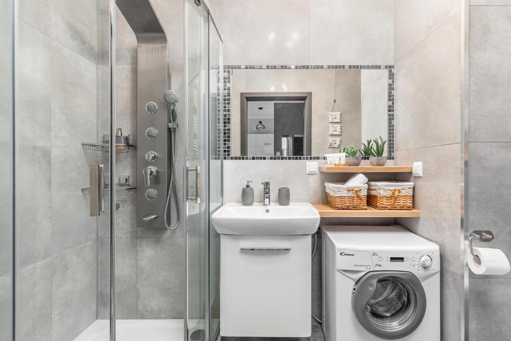 Kúpeľňa v ubytovaní Apartamenty Osiedle Bursztynowe III by Noclegi Renters