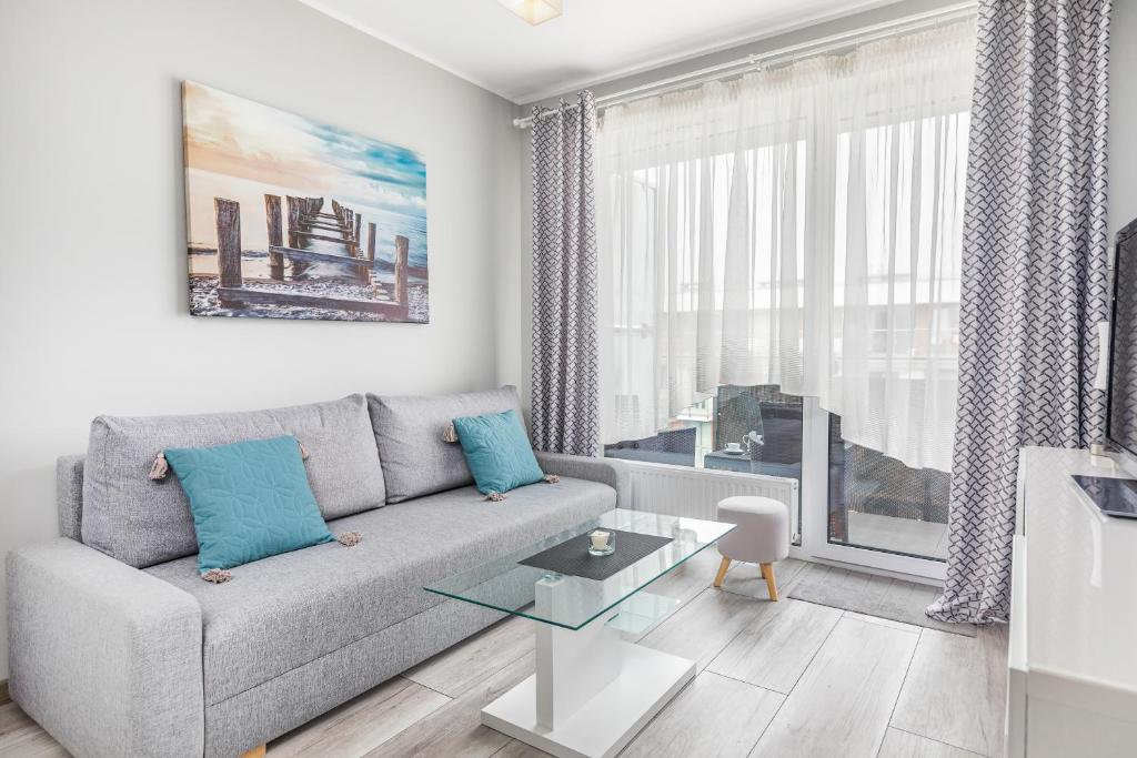 Posedenie v ubytovaní Apartamenty Osiedle Bursztynowe III by Noclegi Renters