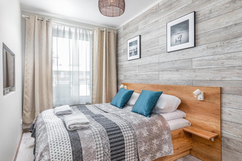 Posteľ alebo postele v izbe v ubytovaní Apartamenty Osiedle Bursztynowe III by Noclegi Renters