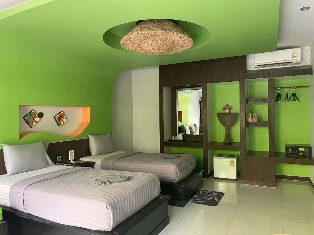 Postel nebo postele na pokoji v ubytování AC 2 Resort
