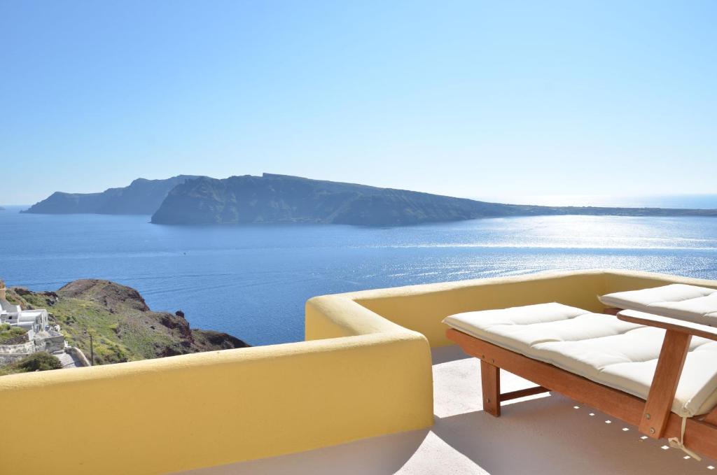 a living room with a view of the ocean at Villa Ariadni Cave Houses in Oia in Oia