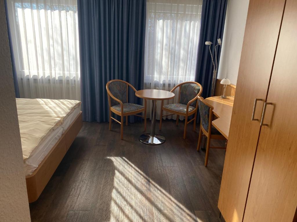 Postel nebo postele na pokoji v ubytování Mirage City Hotel Stuttgart Zentrum