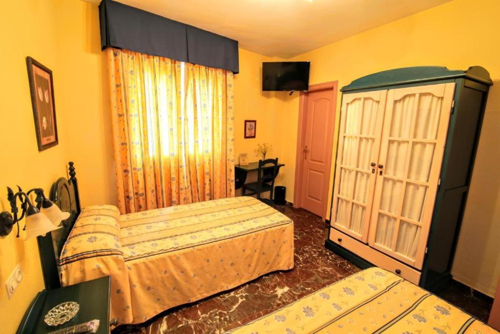 Posteľ alebo postele v izbe v ubytovaní Apartamentos Turísticos La Fonda