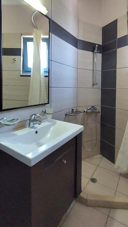 Kúpeľňa v ubytovaní Villa "Thealia", 430 m2 with swimmg pool - sea view