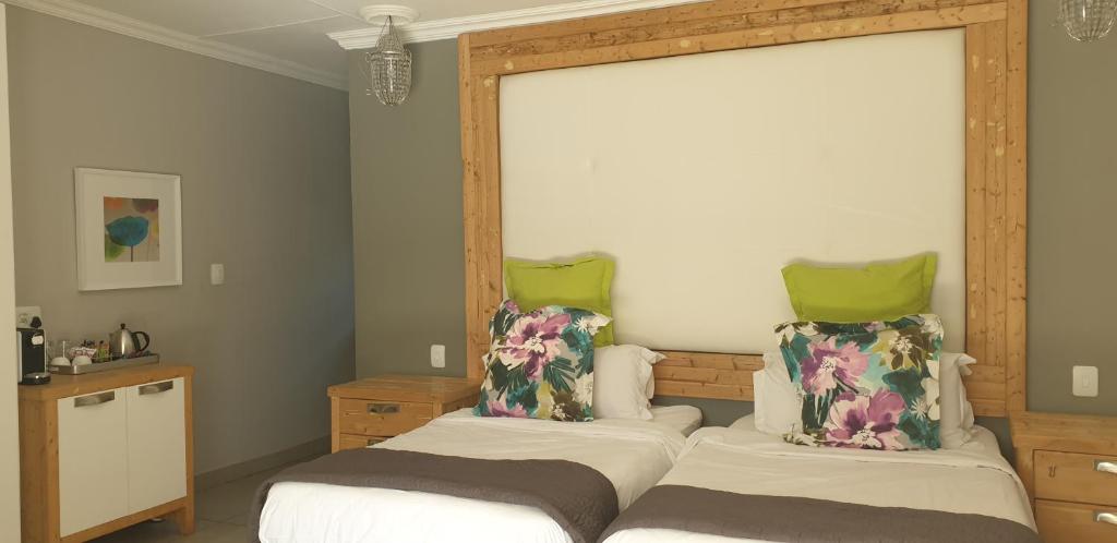 A bed or beds in a room at Country Boutique Hotel