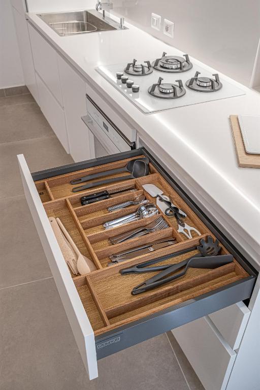 A kitchen or kitchenette at Casa Zummo Ortigia Luxury Apartment